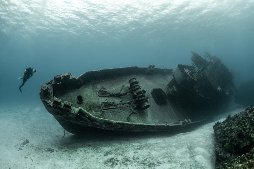 divers-examining-famous-uss-kittiwake-submarine-wreck-grand-cayman-islands.jpg
